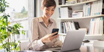 woman-receives-a-message-on-her-phone-from-her-career-coach.jpg-1